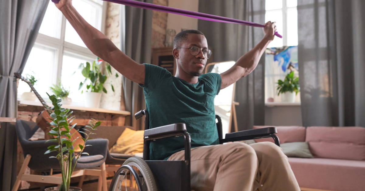 Man in a wheelchair doing exercises, featured image around multiple sclerosis activities