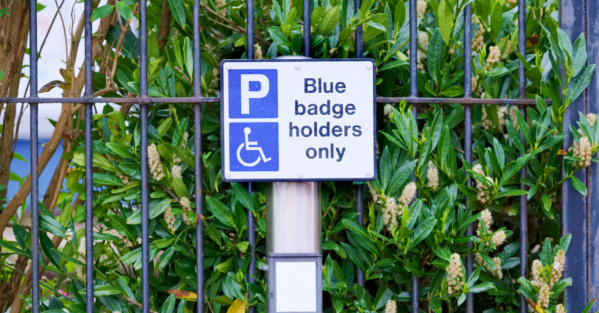 Blue badge scheme sign on a street