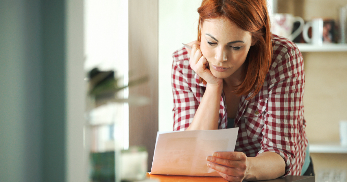 Woman looking at a Universal credit letter