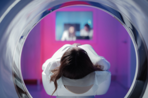 Woman going into an MRI machine multiple sclerosis and brain lesions