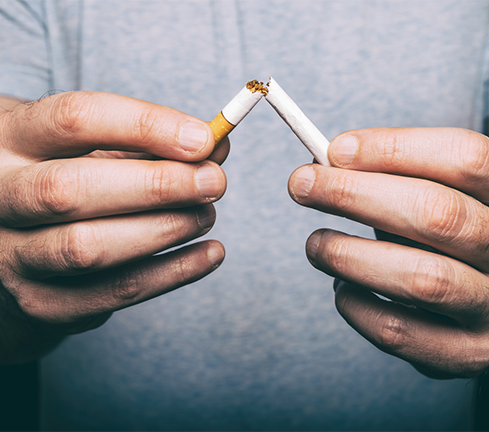 Cigarette being snapped - featured image to illustrate smoking and MS