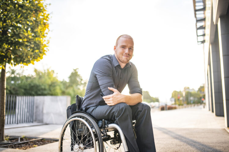 Younger man in a wheel chair - featured image to illustrate secondary progressive multiple sclerosis