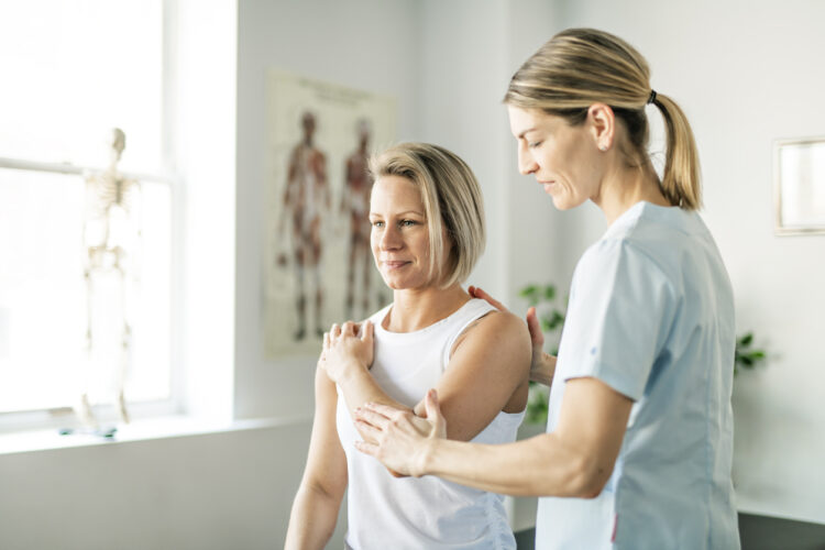 Woman visiting a physio around MS spasticity