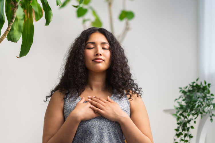 Young woman taking thoughtful breaths for MS and anxiety mental health awareness week