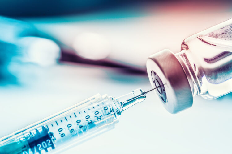 Close-up medical syringe with a vaccine - featured image around the new Epstein-Barr virus vaccine trial hailed a success so far