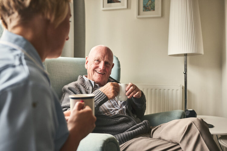Elderly man with a nurse, featured image for the news article around how dementia risk may be higher in people with MS